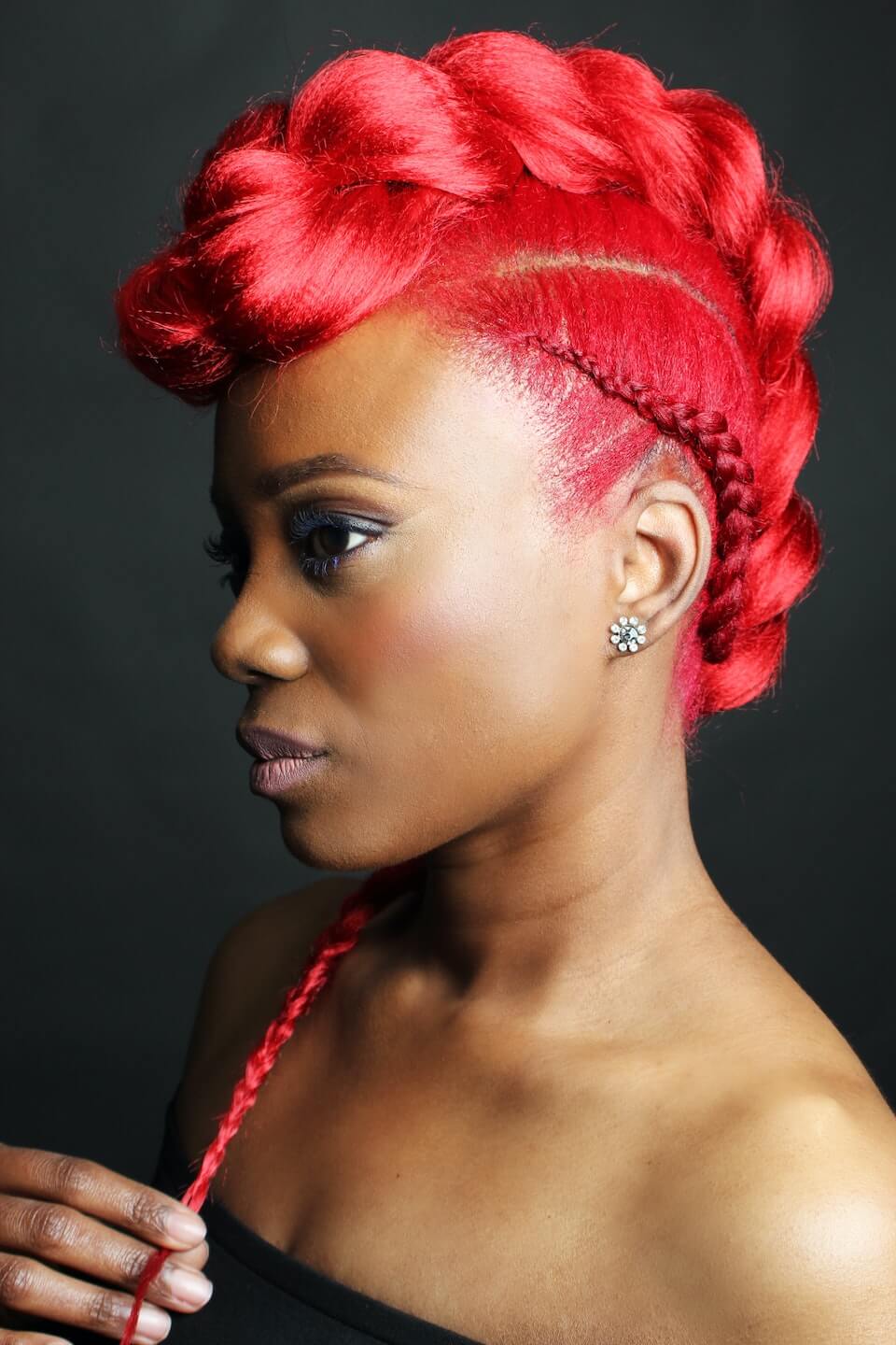 Woman with red hair braided.